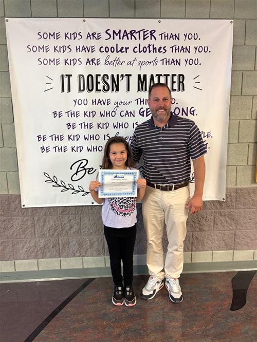 Ariana Cruz-Burgos, Harding's Stairclimber for October, poses with his award plaque.